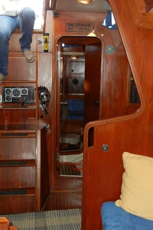 Slide: The Image of Wooden kitchen shelves with dishes and cookware on a 1982 Baltic 42 yacht. - 16