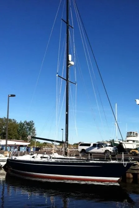Slide: The Image of Baltic 42 sailboat from 1982 being lifted by a marine travel lift. - 2