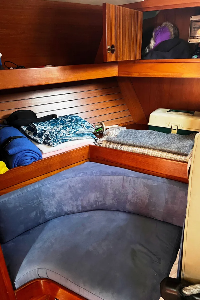 Slide: The Image of Interior of 1982 Baltic 42 sailboat with ropes and nautical equipment neatly stored. - 26