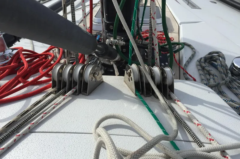 Slide: The Image of Deck rigging on a 1982 Baltic 42 sailboat with colorful ropes and pulleys. - 31