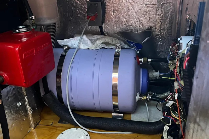 Slide: The Image of Dashboard gauges of a 1982 Baltic 42, showing engine RPM and coolant temperature. - 36