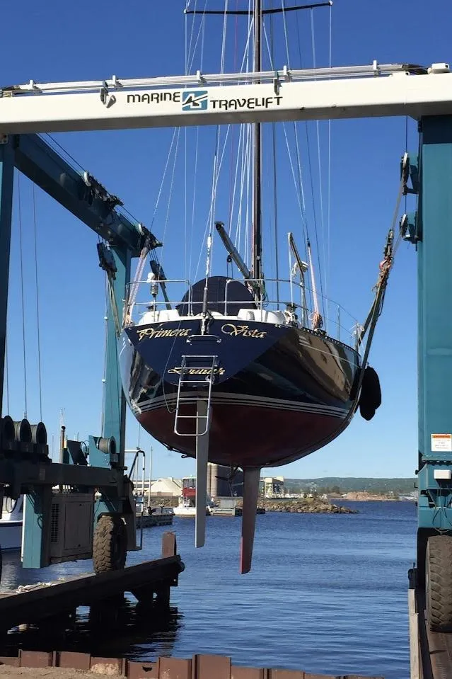 Slide: The Image of Sailing yacht Baltic 42, 1982 model, docked with person adjusting rigging. - 7