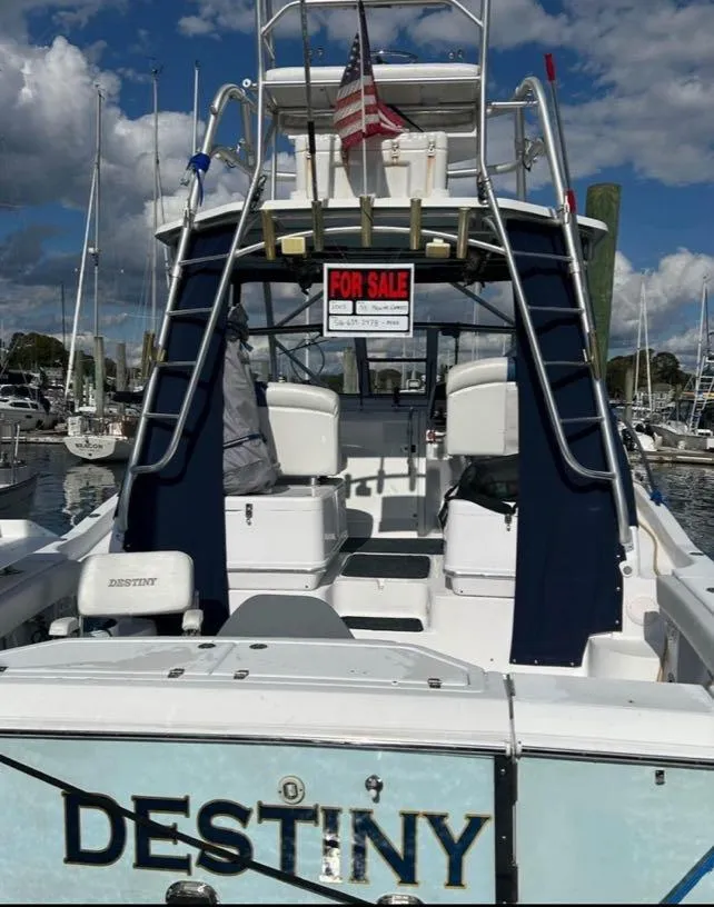 Slide: The Image of 2005 Pro-Line 33 Express boat named "Destiny" for sale at marina. - 2
