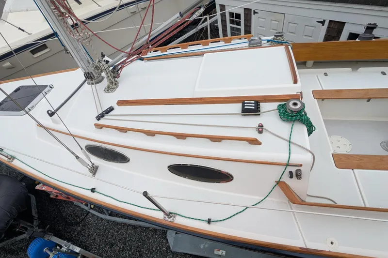 Slide: The Image of 2012 Alerion Express 28 sailboat deck with wooden trim and rigging details. - 10