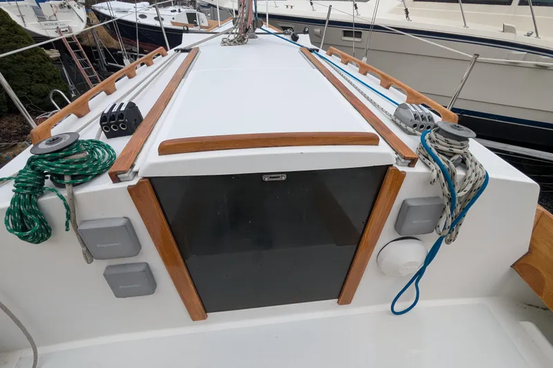 Slide: The Image of Alerion Express 28 sailboat deck, 2012 model, featuring ropes and winches. - 13