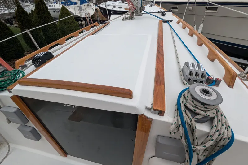 Slide: The Image of 2012 Alerion Express 28 sailboat deck with ropes and winch. - 14