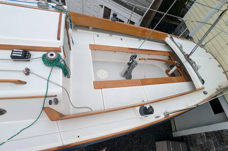 Slide: The Image of 2012 Alerion Express 28 sailboat deck with wooden trim and rigging. - 15