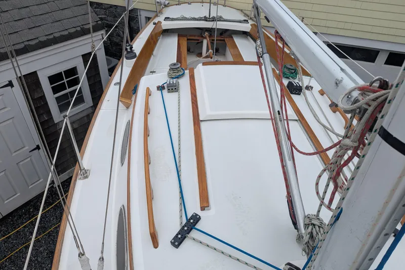 Slide: The Image of Alerion Express 28 sailboat deck, 2012 model, featuring rigging and wooden trim. - 16