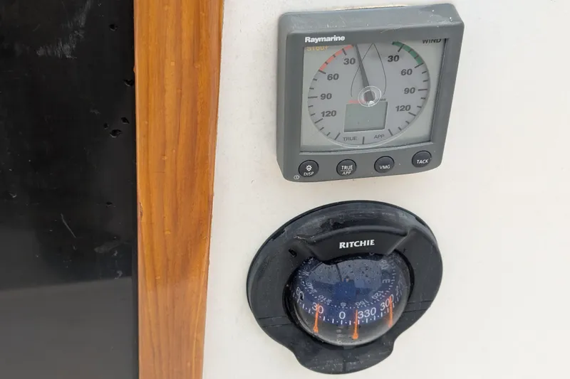Slide: The Image of Alerion Express 28 (2012) boat instruments: Raymarine wind gauge and Ritchie compass. - 20