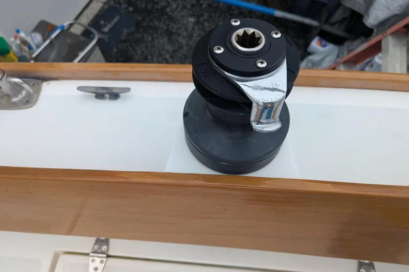 Slide: The Image of Alerion Express 28 sailboat winch, 2012 model, mounted on wooden deck. - 23
