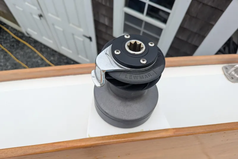 Slide: The Image of Winch on 2012 Alerion Express 28 sailboat deck, near wooden trim. - 24
