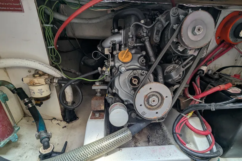 Slide: The Image of Engine compartment of a 2012 Alerion Express 28 sailboat, showing mechanical components and wiring. - 28