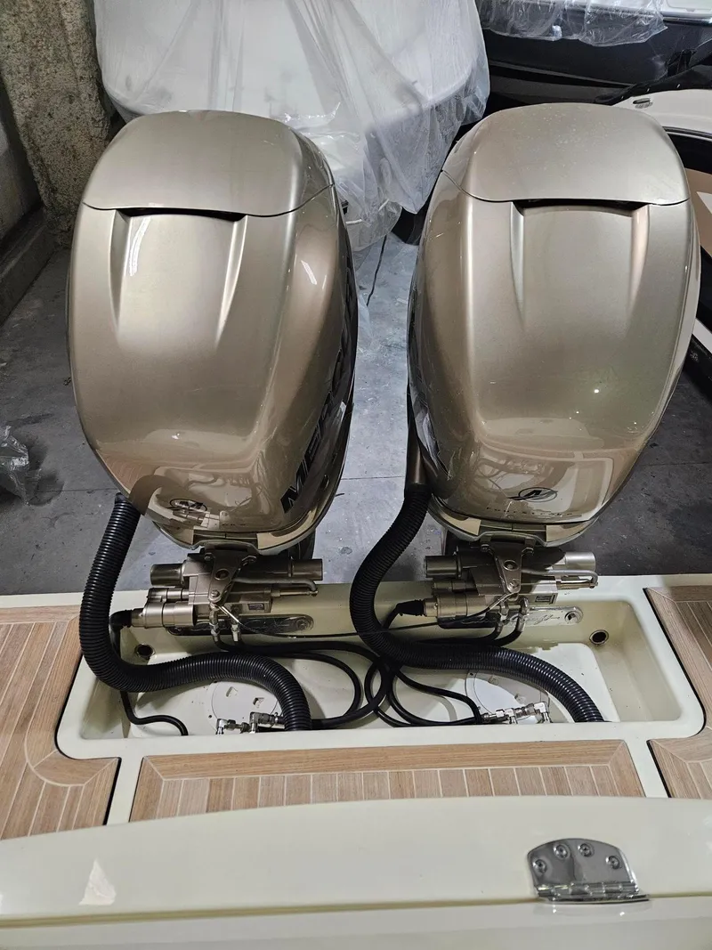 Slide: The Image of Twin Mercury outboard engines on a 2018 Chris-Craft 30 Catalina boat. - 10
