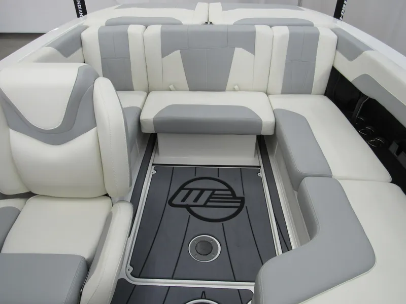 Slide: The Image of 2025 Malibu Wakesetter 20 VTX interior with gray and white seating, logo on floor. - 10
