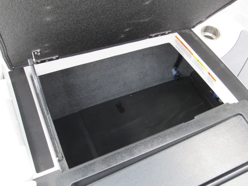 Slide: The Image of Open storage compartment in 2025 Malibu Wakesetter 20 VTX boat. - 11