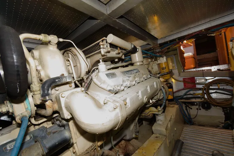 Slide: The Image of Engine room of 1988 Symbol 55 Cockpit Motor Yacht, showcasing mechanical components. - 31