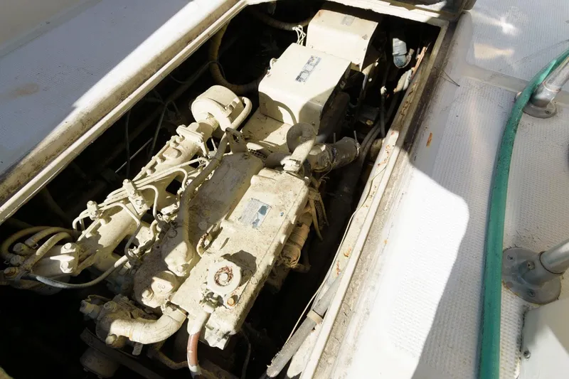 Slide: The Image of Engine compartment of 1988 Symbol 55 Cockpit Motor Yacht, showing mechanical components. - 32