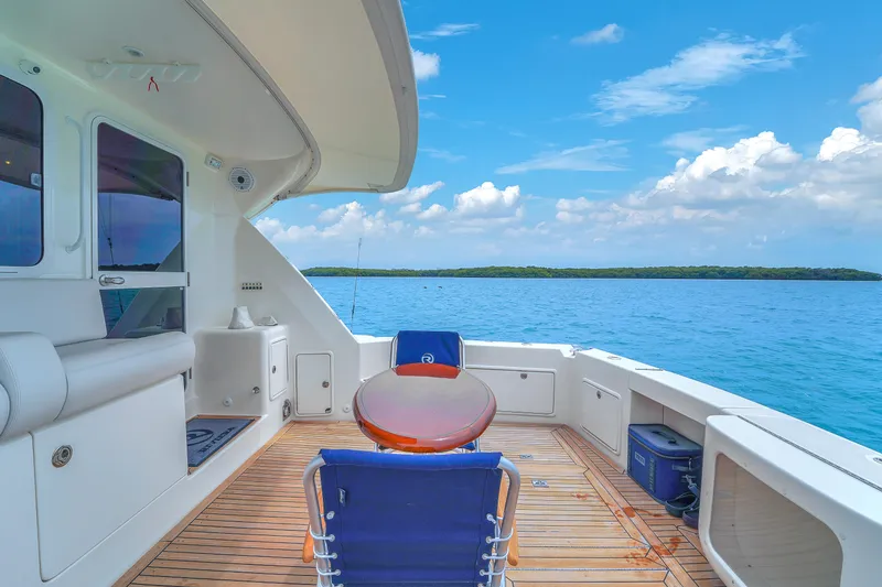 Slide: The Image of 2008 Riviera 51 Enclosed Bridge yacht deck with ocean view and clear skies. - 14