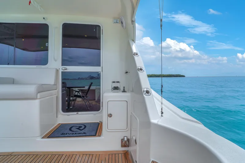 Slide: The Image of 2008 Riviera 51 Enclosed Bridge yacht with ocean view and teak deck. - 18