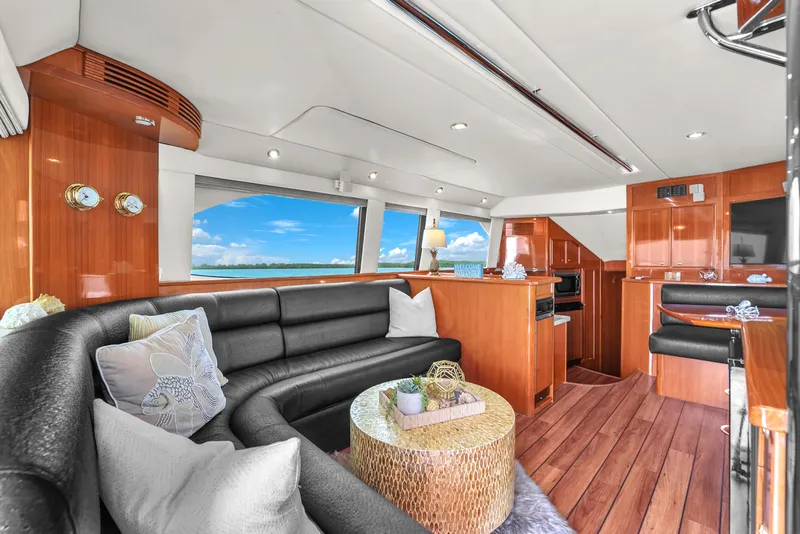 Slide: The Image of Luxurious interior of 2008 Riviera 51 Enclosed Bridge yacht with elegant seating and ocean view. - 20