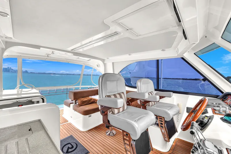 Slide: The Image of Interior of 2008 Riviera 51 Enclosed Bridge yacht with luxurious seating and ocean view. - 48