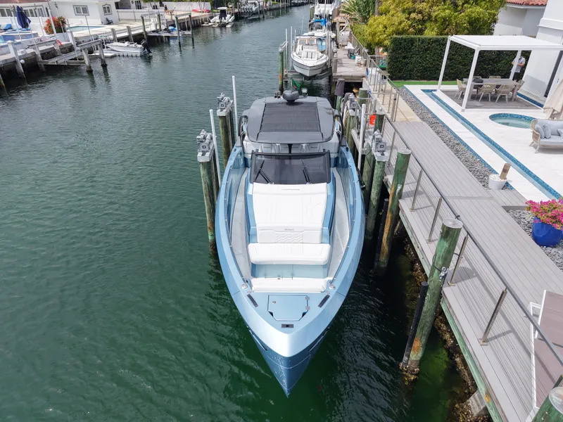 Slide: The Image of Luxury Limitless Seas 45 XLV yacht docked in a serene marina, 2023 model. - 5