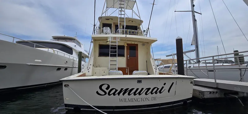 Slide: The Image of 1979 Hatteras 60 Enclosed Bridge Convertible yacht docked, named "Samurai I" in Wilmington, DE. - 14