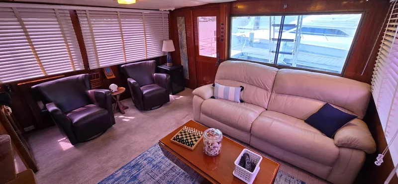 Slide: The Image of Luxurious interior of 1979 Hatteras 60 Enclosed Bridge Convertible yacht with leather seating. - 23