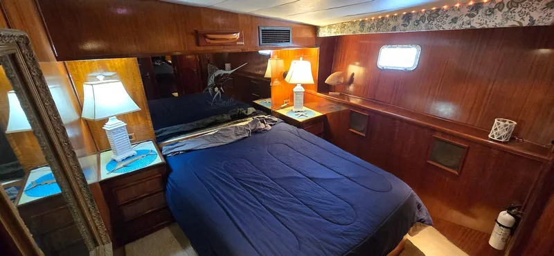 Slide: The Image of Luxurious cabin interior of 1979 Hatteras 60 Enclosed Bridge Convertible yacht. - 30