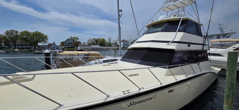 Slide: The Image of 1979 Hatteras 60 Enclosed Bridge Convertible yacht docked at marina. - 9