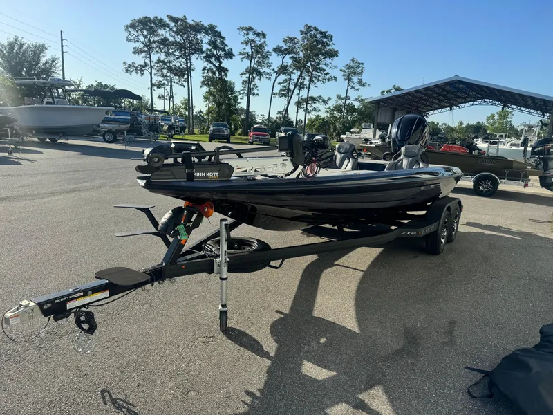 Slide: The Image of 2025 Skeeter ZXR20SE boat on trailer in sunny outdoor setting. - 1