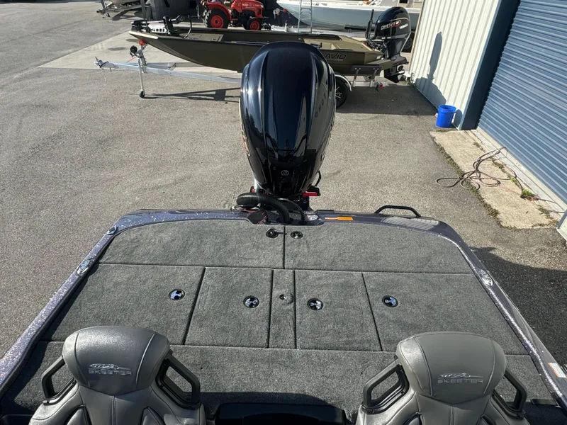 Slide: The Image of 2025 Skeeter ZXR20SE boat with dual seats and powerful outboard motor. - 12