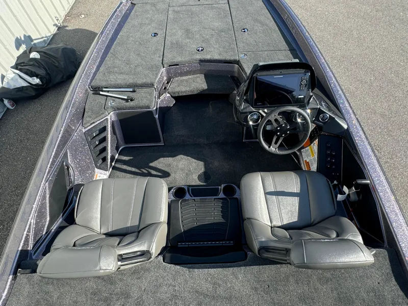 Slide: The Image of 2025 Skeeter ZXR20SE boat interior with dual seats and modern dashboard. - 16