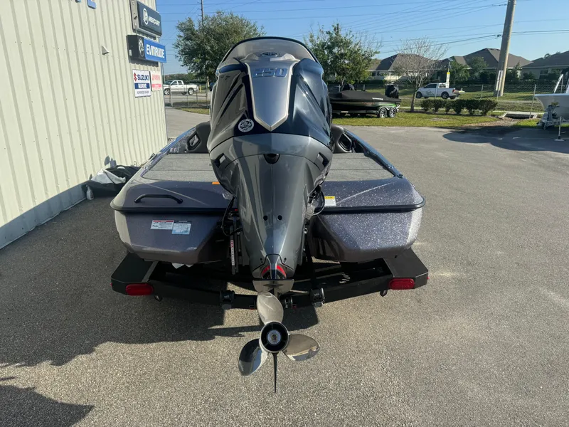 Slide: The Image of 2025 Skeeter ZXR20SE boat with powerful outboard motor, parked outdoors. - 19