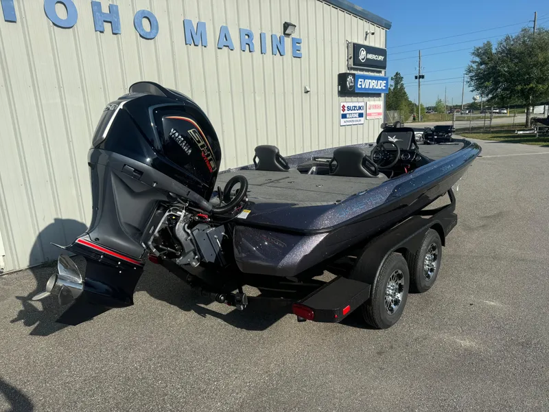 Slide: The Image of 2025 Skeeter ZXR20SE boat on trailer at marine dealership. - 20