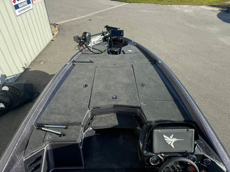 Slide: The Image of 2025 Skeeter ZXR20SE boat interior with advanced navigation system and spacious deck. - 8