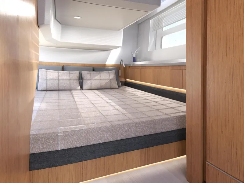 Slide: The Image of Luxurious cabin interior of 2025 Moody 48 Deck Saloon yacht with modern bedding and wood finishes. - 12