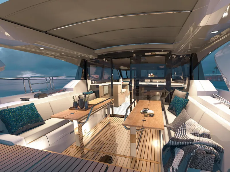 Slide: The Image of Luxurious 2025 Moody 48 Deck Saloon yacht interior with elegant seating and wooden tables. - 2