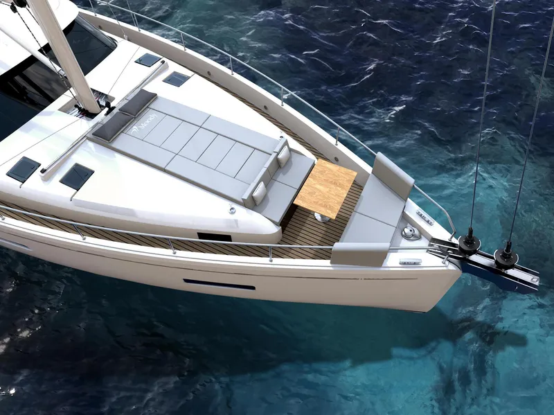 Slide: The Image of Luxury Moody 48 Deck Saloon yacht sailing on clear blue waters, 2025 model. - 5