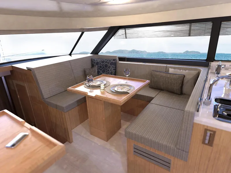 Slide: The Image of Luxurious interior of 2025 Moody 48 Deck Saloon yacht with elegant dining area. - 9