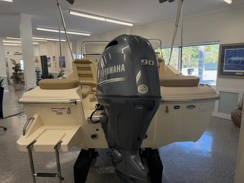 Slide: The Image of 2023 Scout 175 Sport Dorado boat with Yamaha 90 engine in showroom. - 2