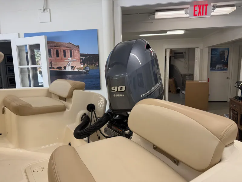 Slide: The Image of 2023 Scout 175 Sport Dorado boat interior with Yamaha 90 engine in showroom. - 4