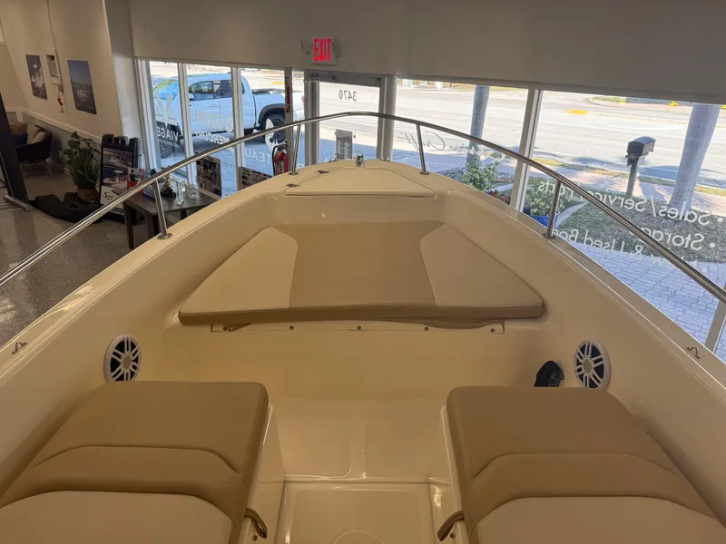 Slide: The Image of 2023 Scout 175 Sport Dorado boat interior with beige seating and spacious layout. - 7