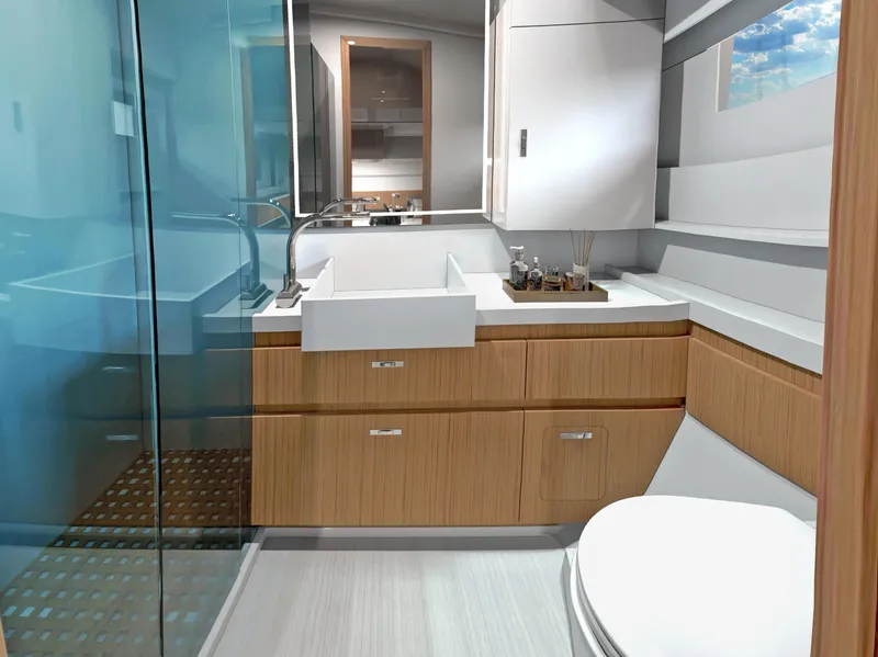 Slide: The Image of Modern bathroom interior on 2025 Moody 48 deck saloon yacht, featuring sleek design and wooden cabinetry. - 14