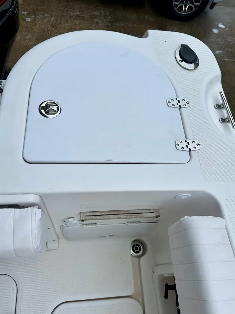 Slide: The Image of 2007 Pro-Line 23 Express boat deck with storage compartment and seating. - 5