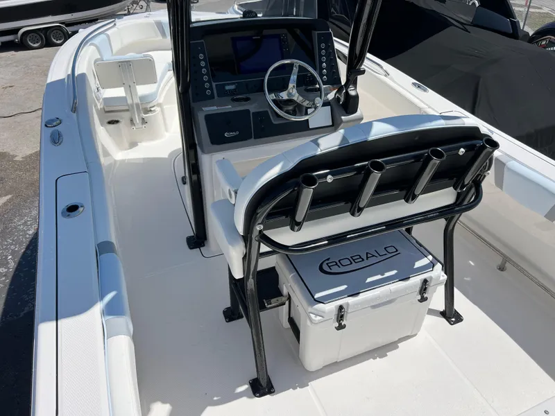Slide: The Image of 2025 Robalo R232 Explorer boat interior with steering console and seating. - 8