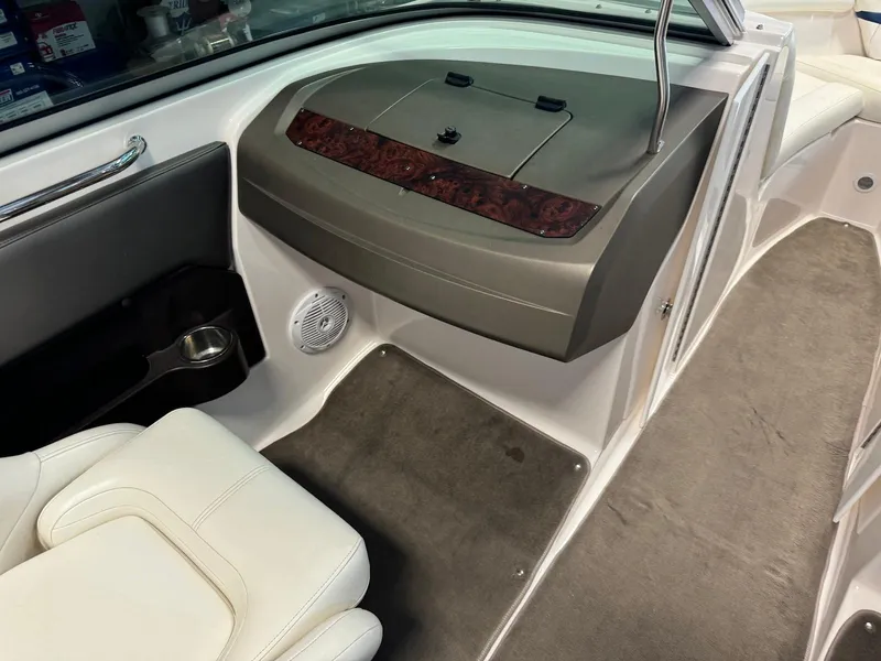 Slide: The Image of 2006 Regal 2200 Bowrider interior with white seating and dashboard details. - 14