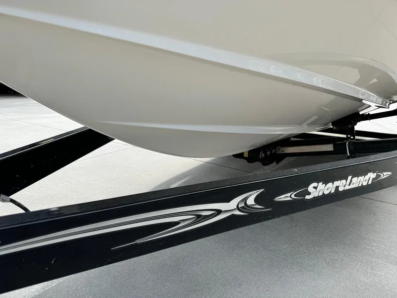 Slide: The Image of 2006 Regal 2200 Bowrider on ShoreLand'r trailer, close-up view. - 7