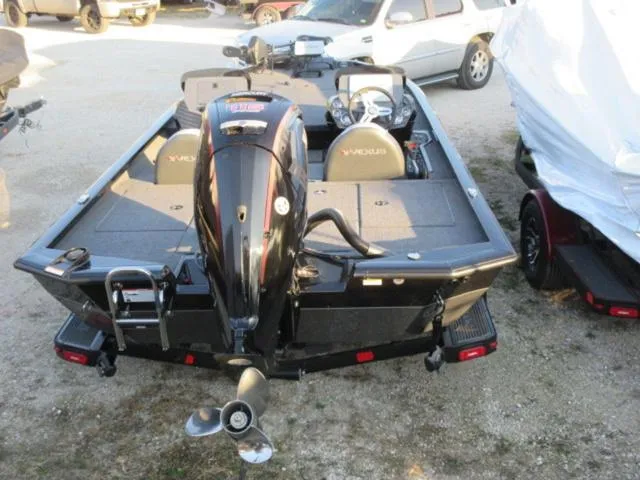 Slide: The Image of 2024 Vexus AVX1880 boat with Mercury 115 ProXS engine, rear view in a parking area. - 5