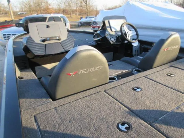 Slide: The Image of 2024 Vexus AVX1880 boat interior with Mercury 115 ProXS engine, featuring dual seats and steering console. - 7